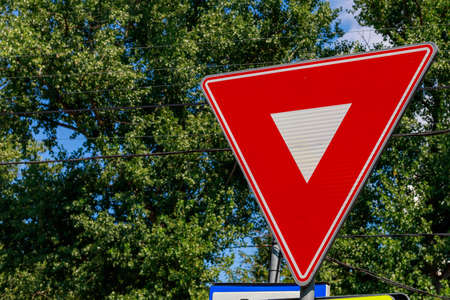 Road warning sign red inverted triangle. Background with copy space for text