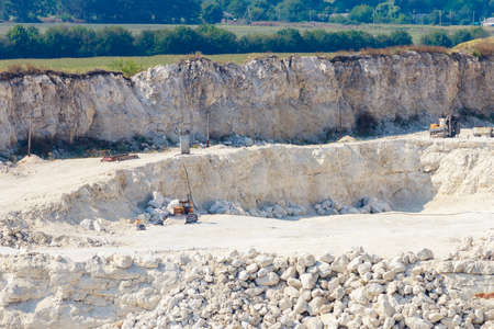 The operating huge quarry for the extraction of stone. Natural limestone. Background with copy space for textの写真素材