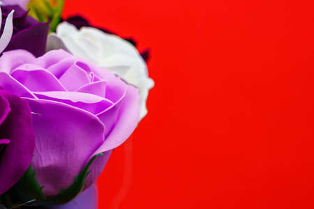 Artificial flowers made from soap. Gift bouquet with selective focus. Congratulations on the birthday of a girl or a holiday for women. Wedding and engagement. Copy space background for textの写真素材