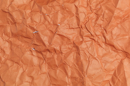 Rough crumpled texture surface of retro old vintage classic grunge paper. Background or backdrop. Design blank. Dark orange, Brown toneの写真素材