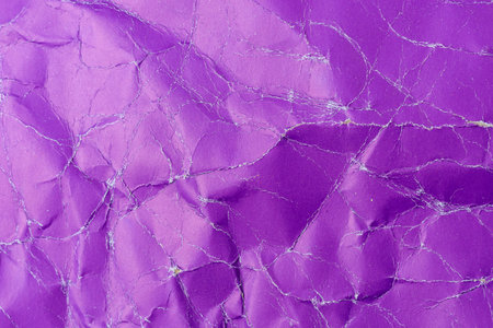 Rough crumpled texture surface of retro old vintage classic grunge paper. Background or backdrop. Design blank. Dark violetの写真素材