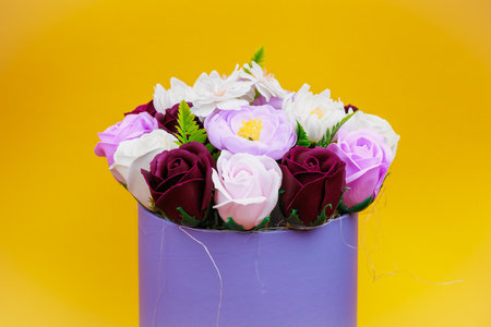 Artificial flowers made from soap. Gift bouquet with selective focus. Congratulations on the birthday of a girl or a holiday for women. Wedding and engagement.の写真素材