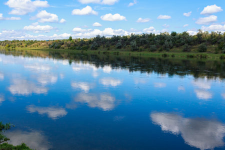 Wide river. Eastern european background with copy space for text or lettering. Ideal for fishing and rafting. View through the eyes of a touristの写真素材