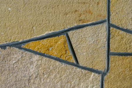 Rough textured natural stone wall surface. Background or backdrop. Blank or graphic resource for...