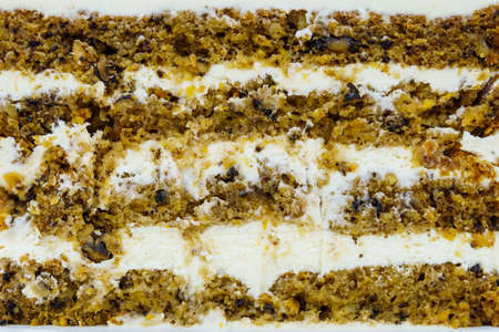 Sliced piece of cake. Background with copy space for text or inscription. Layers of cakes with cream.の写真素材