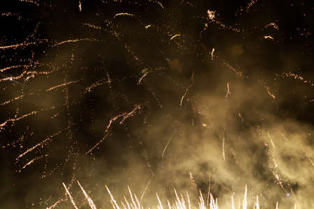 Fireworks sparks on a black sky background with copy space for text or inscriptions. A graphic...