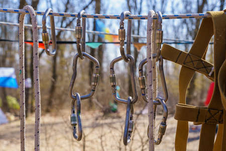 Carabiners for tourism on a blurred background with selective focus and copy space for textの写真素材
