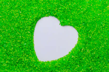 Texture of sea aromatic salt with heart shaped copy space for text. Spa and relaxation concept. Background or backdrop. Blank for design, graphic resource for the designer.の写真素材