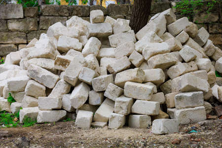 Heaped limestone blocks. Background with selective focus and copy space for textの写真素材