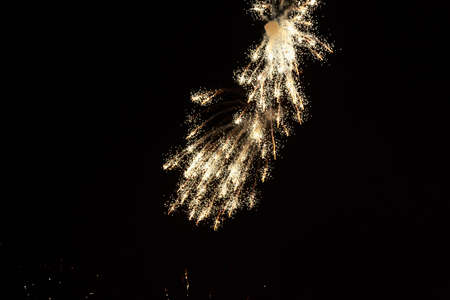 Fireworks sparks on a black sky background with copy space for text or inscriptions. A graphic...