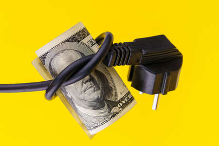 The president on a dollar bill with his eyes blindfolded with an electric cord. The concept of the...
