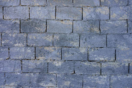 Primed masonry wall of limestone blocks. Texture background or backdrop for design