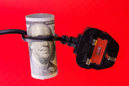 The president on a dollar bill with his eyes blindfolded with an electric cord. The concept of the...