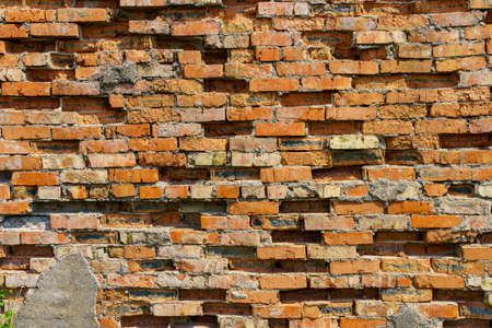Destroyed bricks of the wall. Texture background or backdrop for design