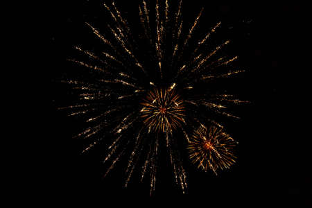 Very beautiful fireworks against the black sky with copy space for text or inscriptions. A graphic...