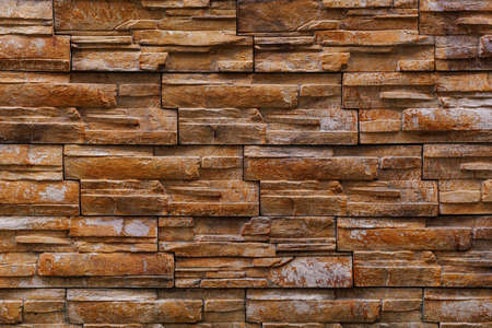 Textured rough surface of decorative natural stone wall. Background or backdrop. A blank for design...
