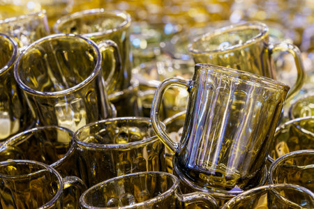 Unbreakable dark clear glass mugs. Background with copy space for textの写真素材