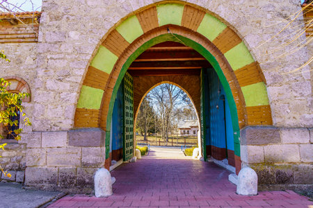 Stone arch at the entrance to the old stone church. Background with selective focus and copy space for text. Classic vintage architectureの写真素材