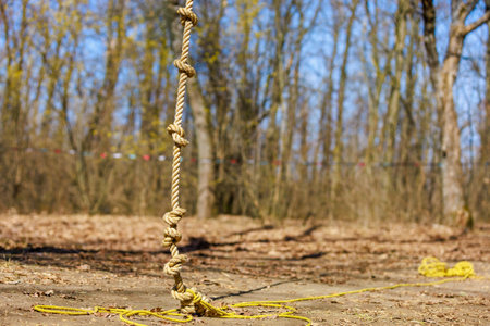 Rope with knots for training amateur tourists on a blurred background of nature. Background with copy space for textの写真素材