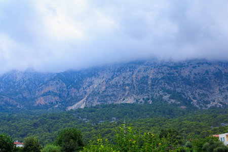 Foggy mountains with haze in Turkish resort place. Background with copy spaceの写真素材
