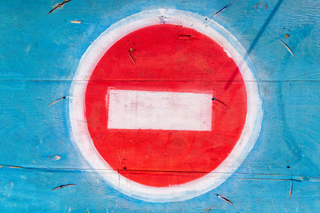 Improvised wood-painted road sign brick or no entry. Background with copy spaceの写真素材