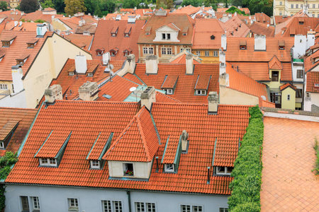 Roofs of houses and a view of the city of Prague. Background with selective focus and copy space for textの写真素材