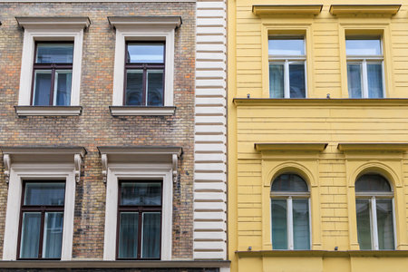 Facade of the house of classical European architecture of the old cozy tourist city. Background with selective focus and copy spaceの写真素材