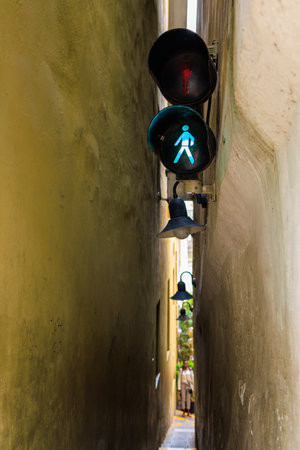 The narrowest pedestrian street in Prague with traffic lights and one-way traffic. Background with selective focus and copy space for textの写真素材