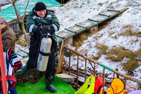 January 19, 2022 Balti Moldova A lifeguard or diver is on duty for traditional Epiphany bathing on a religious holiday. Editorial use only, backgroundのeditorial素材