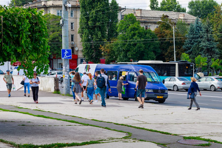 People at a public transport stop. August 19, 2021 Chisinau Moldova, for illustrative editorial use. Background with copy space for textのeditorial素材