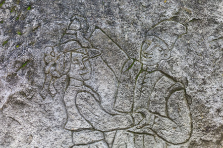 Ancient rock carvings in the form of people in national clothes. August 26, 2021 Chisinau Moldova, for illustrative editorial use. Background with copy space for textのeditorial素材