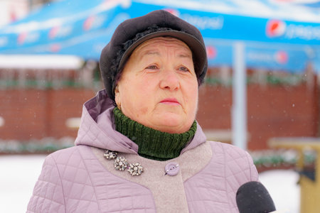 A local resident talks about life in the city and answers questions. December 28, 2021 Balti Moldova. Illustrative editorialのeditorial素材