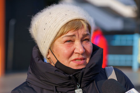 A local resident talks about life in the city and answers questions. November 23, 2021 Balti Moldova. Illustrative editorialのeditorial素材