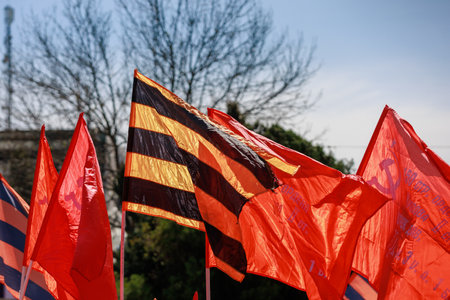 April 15, 2022 Balti Moldova, Protest against the ban on the St. George ribbon. USSR Victory Flags. Illustrative editorial backgroundのeditorial素材