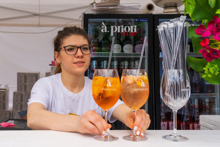 Aperol stall. Bartenders at work at a street food festival. June 25, 2022 Balti Moldova. Illustrative editorialのeditorial素材