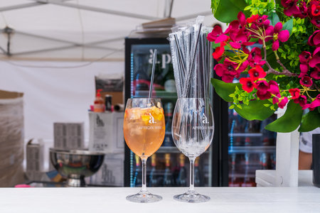 Aperol glasses. Drinks at the street food festival. June 25, 2022 Balti Moldova. Illustrative editorialのeditorial素材