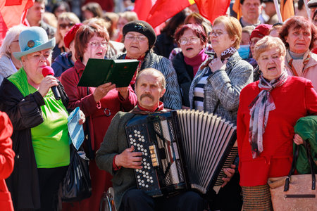 April 15, 2022 Balti Moldova, Protest rally against the ban on the St. George Ribbon. Pensioners sing patriotic songs to the accordion. Illustrative editorial backgroundのeditorial素材