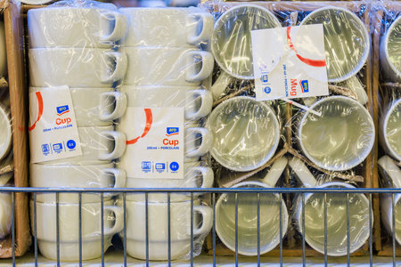 Mugs and cups for hot drinks on a store shelf. Illustrative editorial. May 12, 2022 Balti Moldovaのeditorial素材