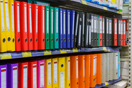 Folders for the office in the stationery department on the store shelf. Illustrative editorial....