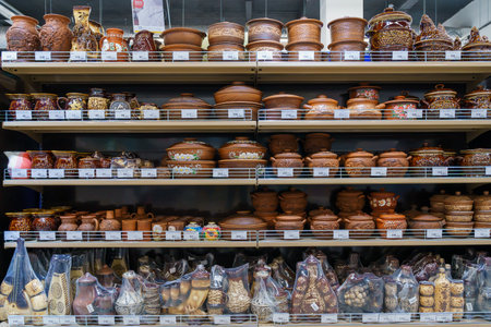 Shelves with earthenware eco-friendly utensils in the store. Illustrative editorial. April 13, 2022 Balti Moldovaのeditorial素材