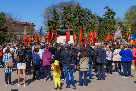 April 15, 2022 Balti Moldova, Protest against the ban on the St. George ribbon. Crowd of people in the square. Illustrative editorial backgroundのeditorial素材