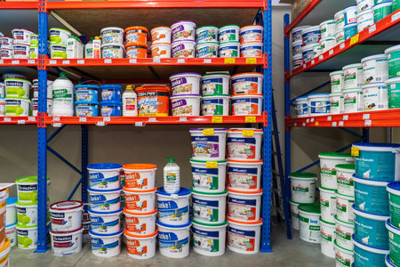 Buckets of primer and paint, all-purpose glue. Goods in a building materials store. June 24, 2022 Beltsy Moldova.のeditorial素材