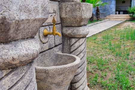 August 11, 2022 Beldibi, Kemer district, Antalya Province, Turkey. Traditional washbasin in the courtyard of the mosque. Background with copy space for textのeditorial素材
