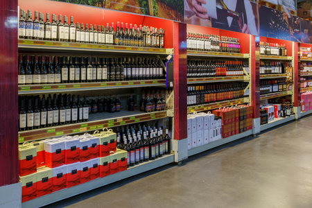 Wine bottles. Goods on the store shelf, supermarket showcase. February 24, 2022 Beltsy Moldova.のeditorial素材