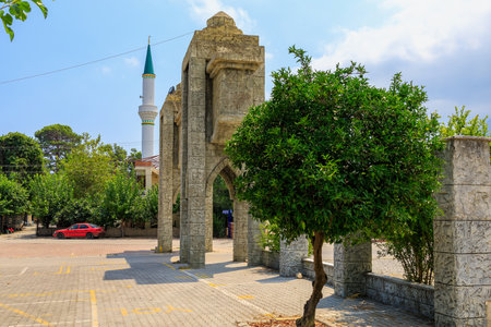Turkish city gate in classical Islamic architecture style. Background with copy space for text. August 7, 2022 Beldibi Antalya province, Kemer region Turkey.のeditorial素材