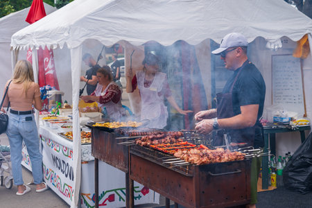 Chefs prepare food at the street food festival. June 25, 2022 Balti Moldova. Illustrative editorialのeditorial素材