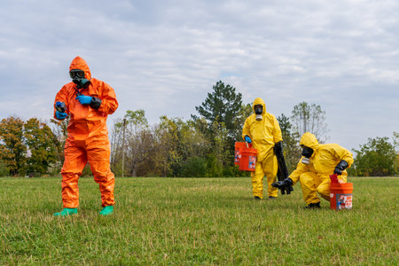 People in chemical protection suits are looking for a source of radiation contamination. Radiation and Chemical Protection. October 12, 2022 Balti Moldova.のeditorial素材