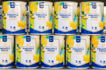 July 7, 2022 Beltsy, Moldova. For illustrative editorial use. Canned pineapple pieces.のeditorial素材