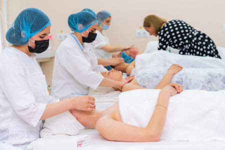 May 17, 2022 Balti Moldova. Beautician performs the procedure. Illustrative editorial. Backgroundのeditorial素材