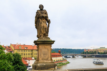 August 24, 2022 Prague, Czech Republic. Antique sculptures on the Charles Bridge. Background with copy spaceのeditorial素材